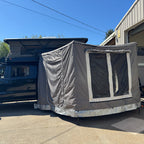 cascadia overland co apex camper with awning and annex room open 